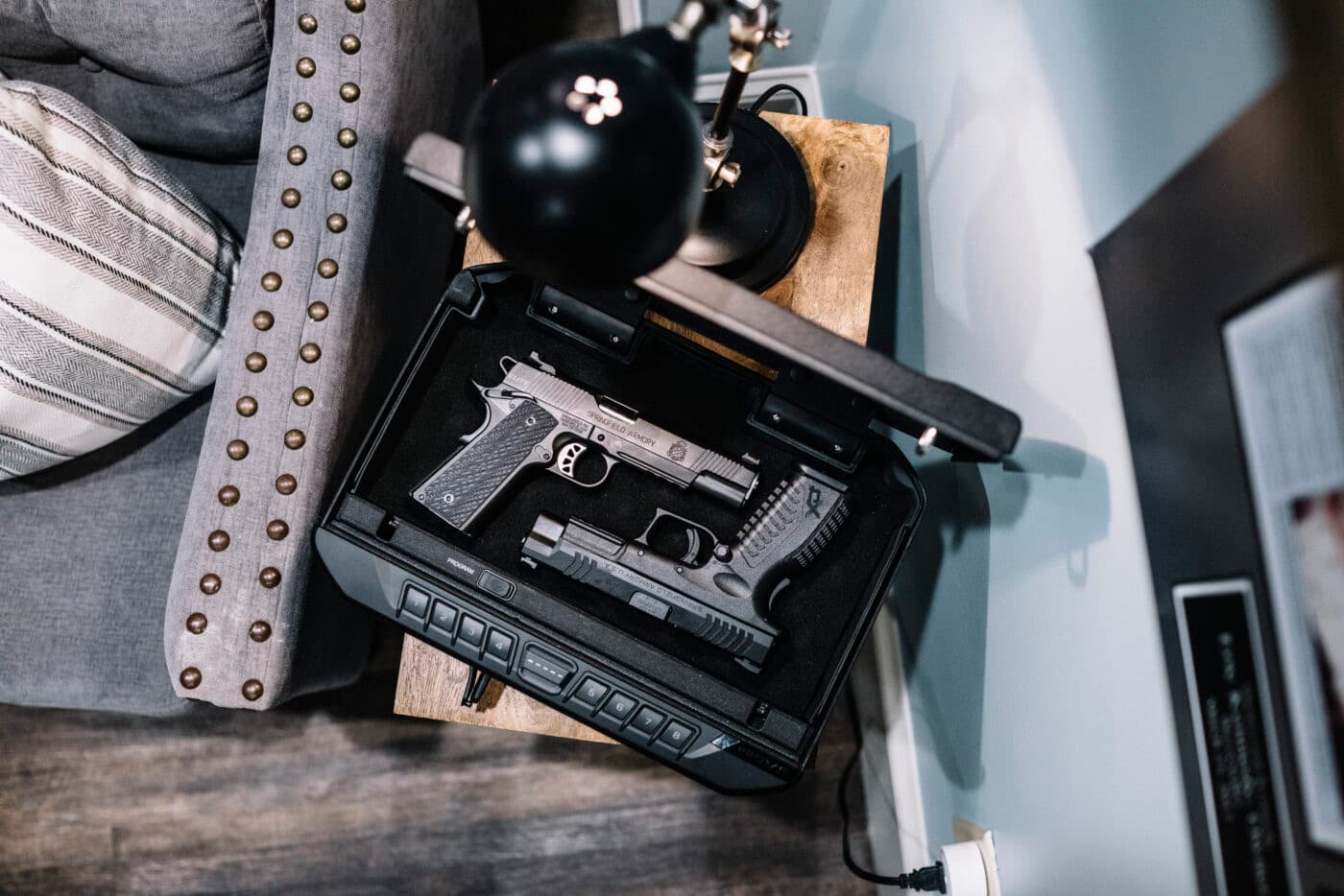 Pistols on a side table in a storage safe