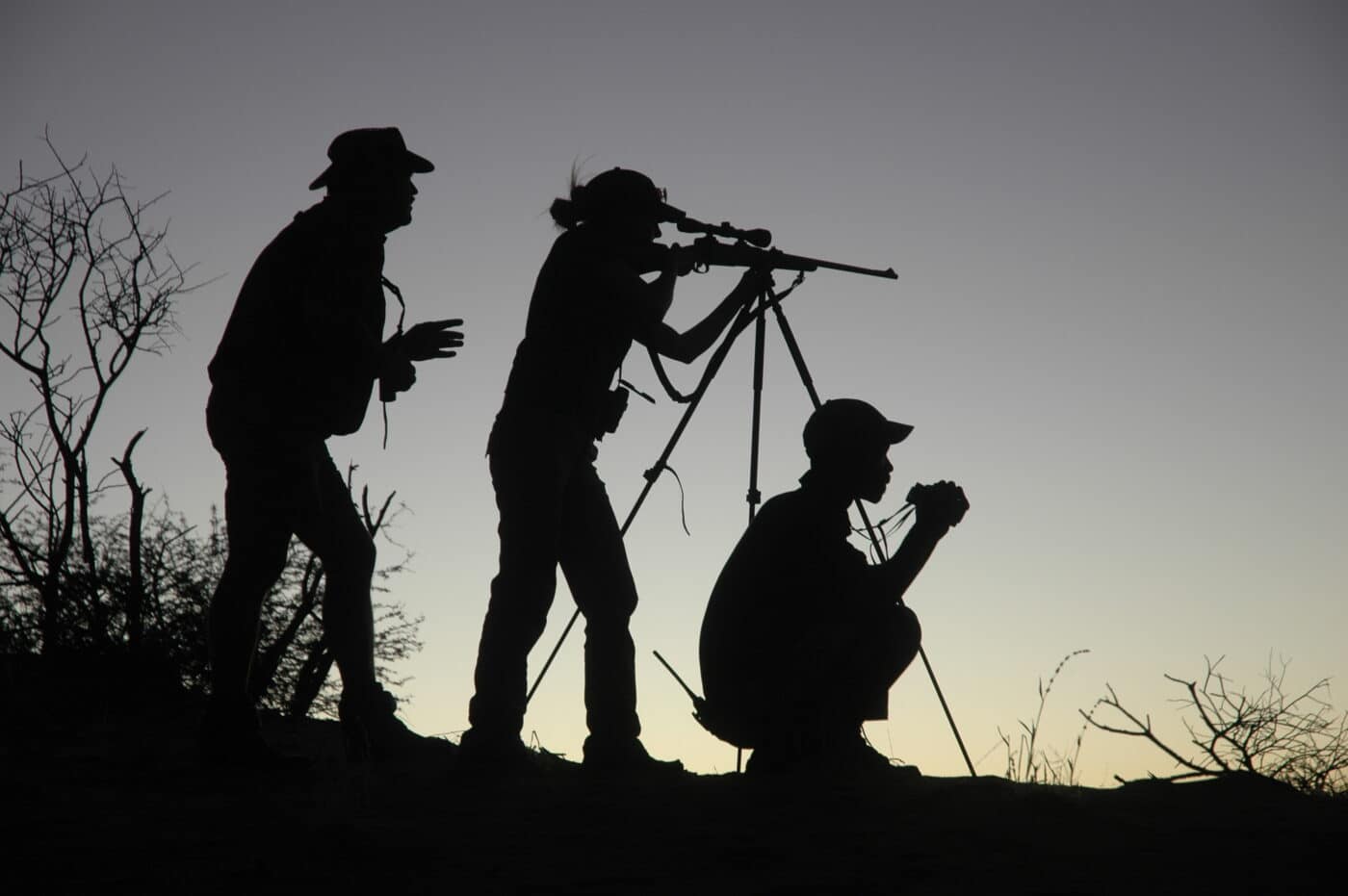 Hunters with 6.5 Creedmoor rifle on a tripod