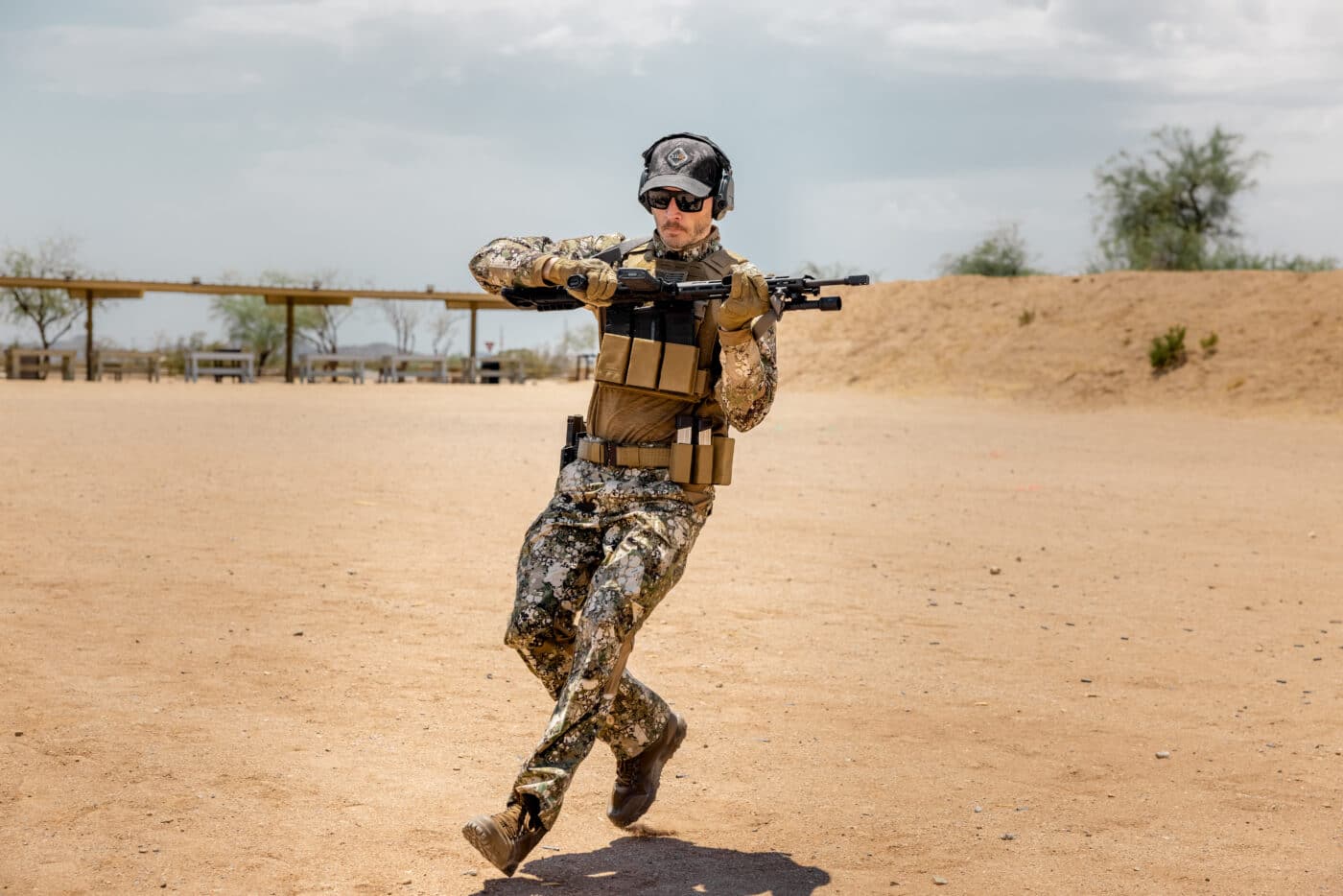 Man moving while training with AR-15 rifle