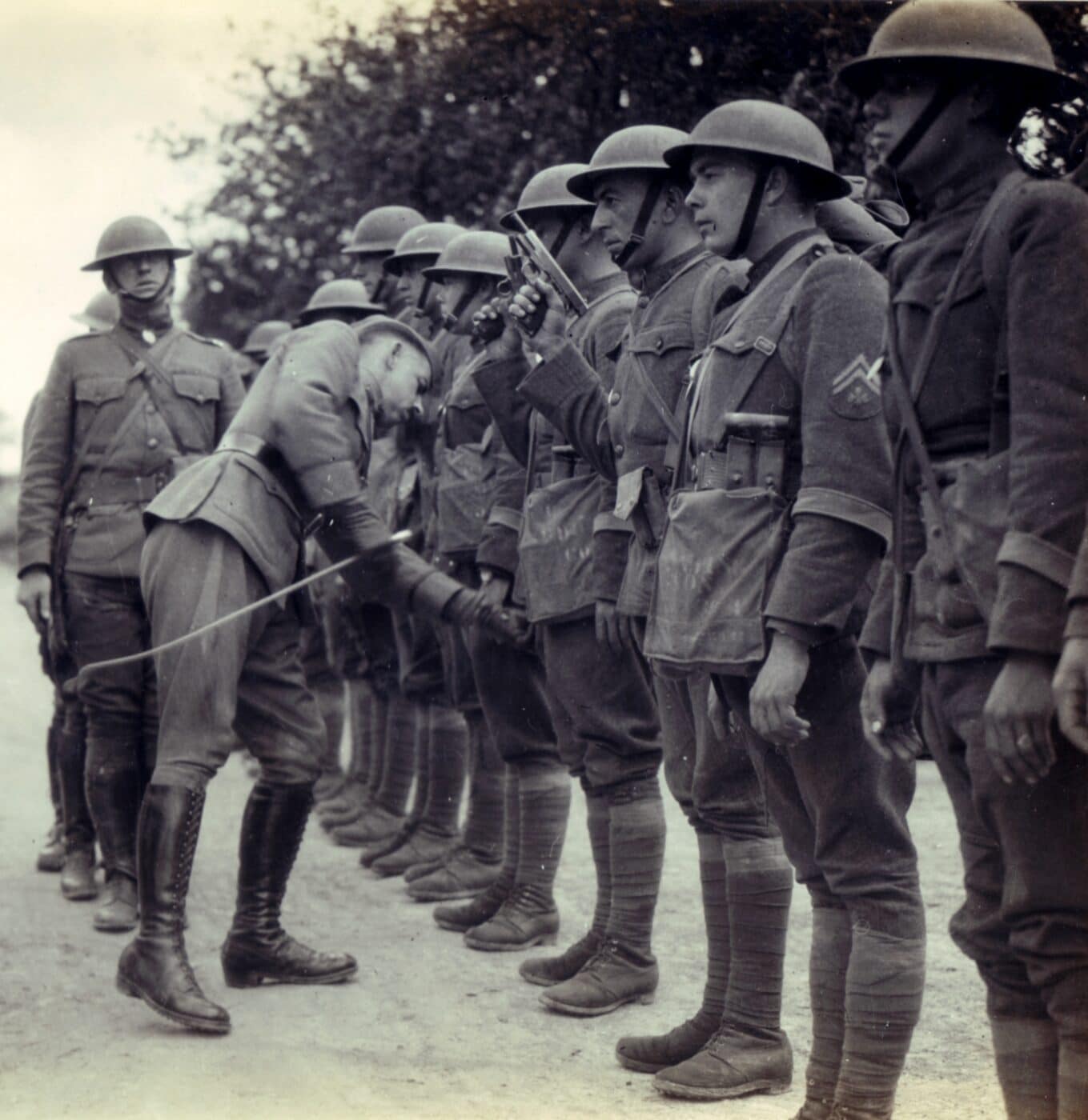 Men of the 1st Battalion of the U.S. Signal Corps present arms for inspection in France, May 1918.
