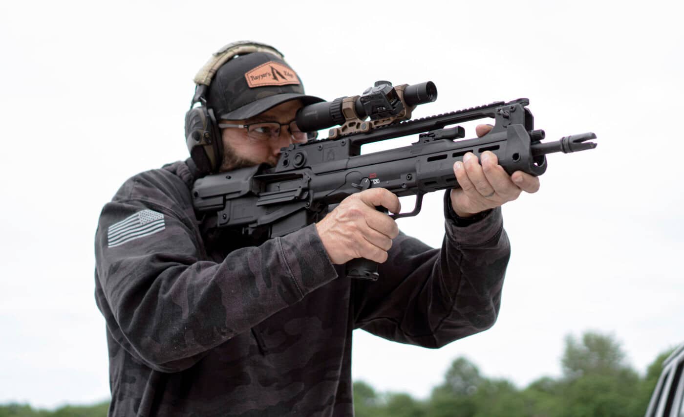 Man shooting Springfield Hellion rifle with Leupold scope mounted