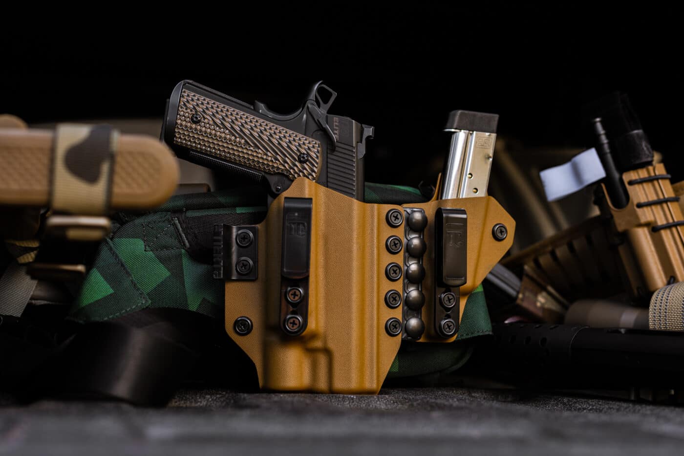 Tier 1 Agis appendix holster with pistol inside next to other gear
