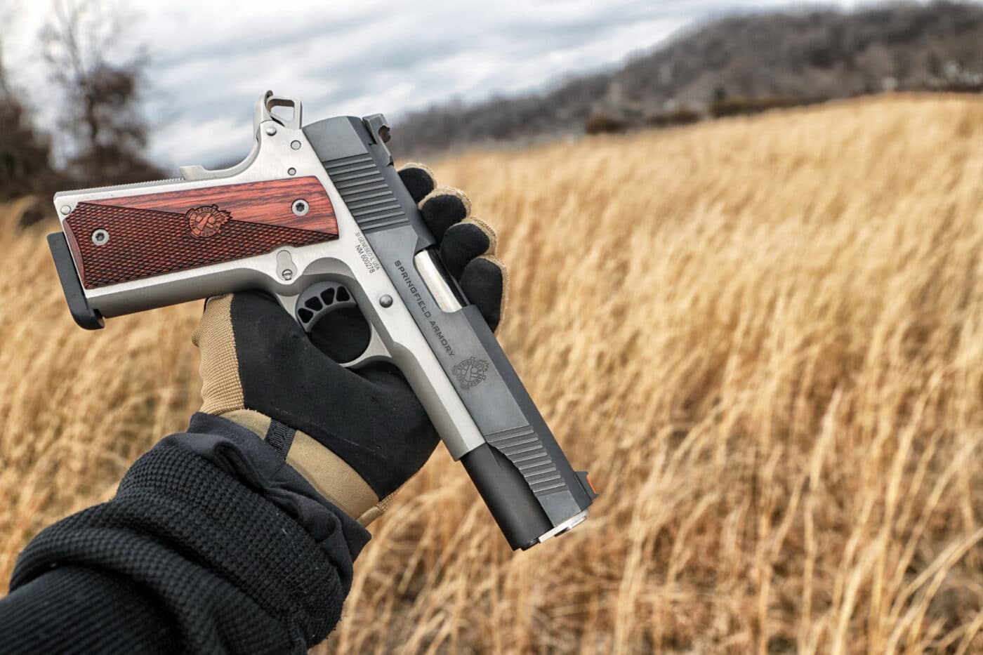 Person holding a Springfield Armory Ronin 10mm 1911 pistol