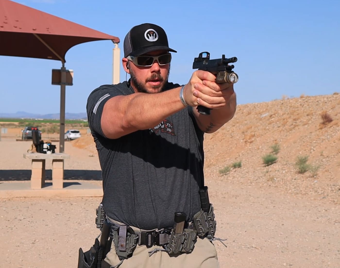 Man holding pistol in slide lock