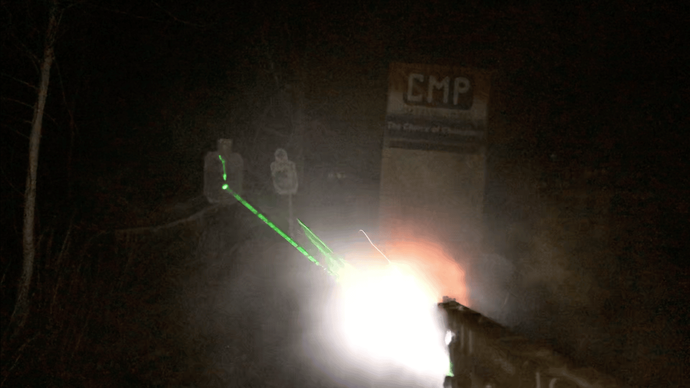 Demonstration of the brightness of light and green laser on Viridian C5L at night outdoors