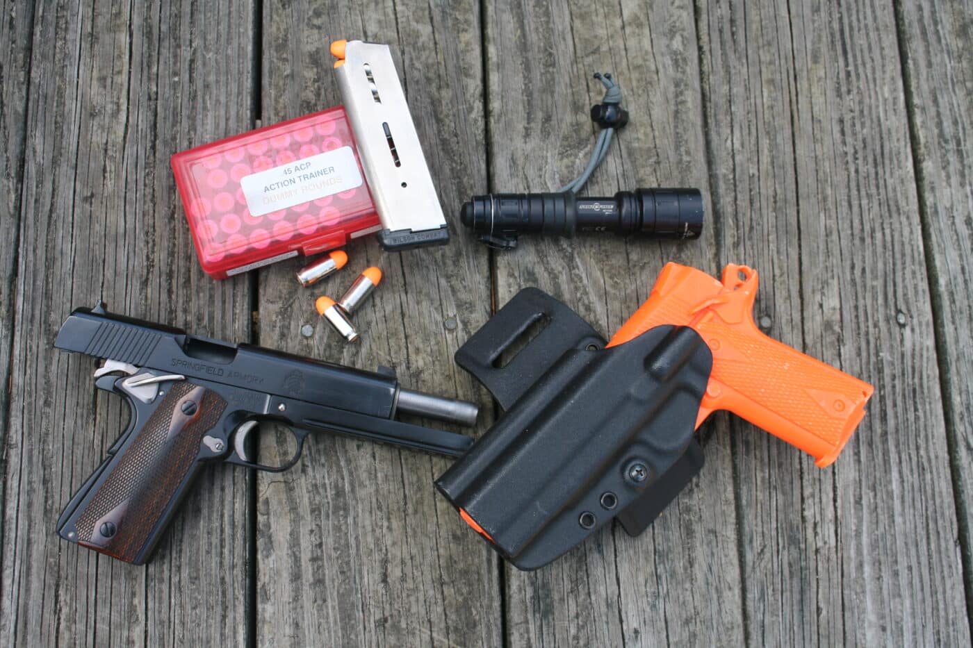 empty gun, inert trainer, dummy rounds and a flashlight