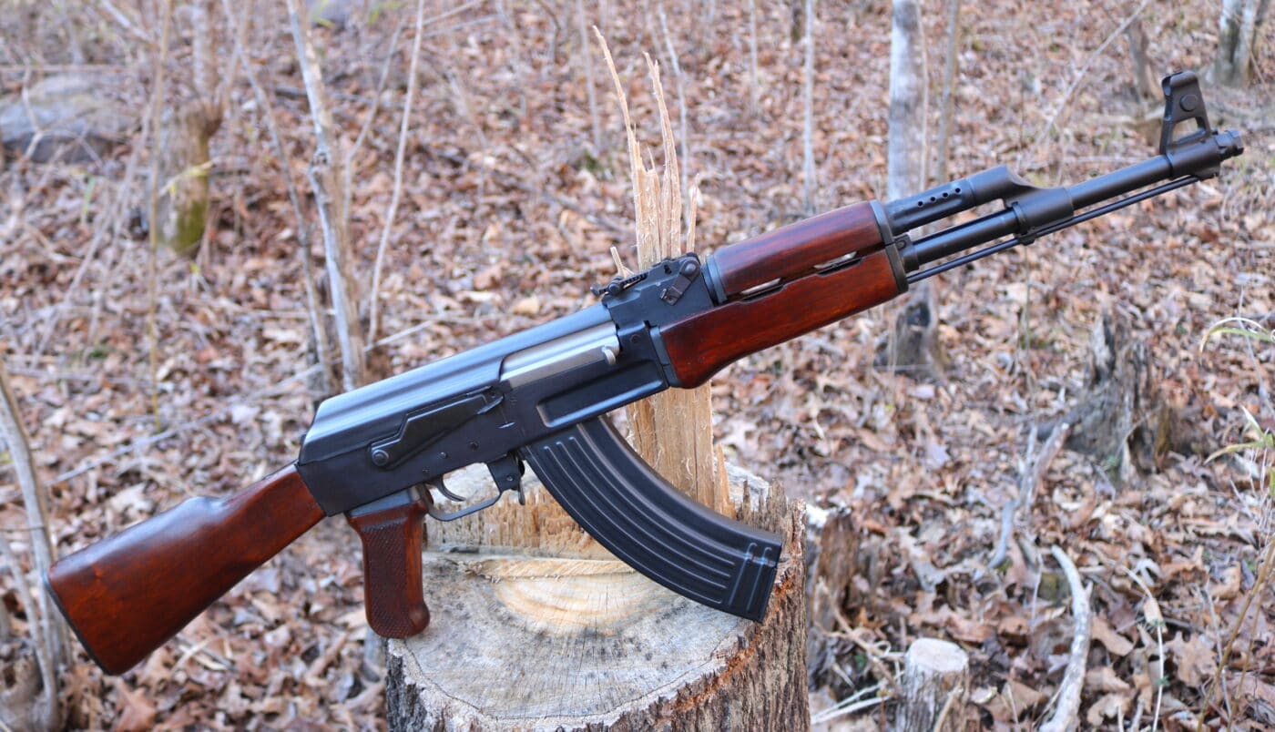 AK-47 rifle resting on a tree stop