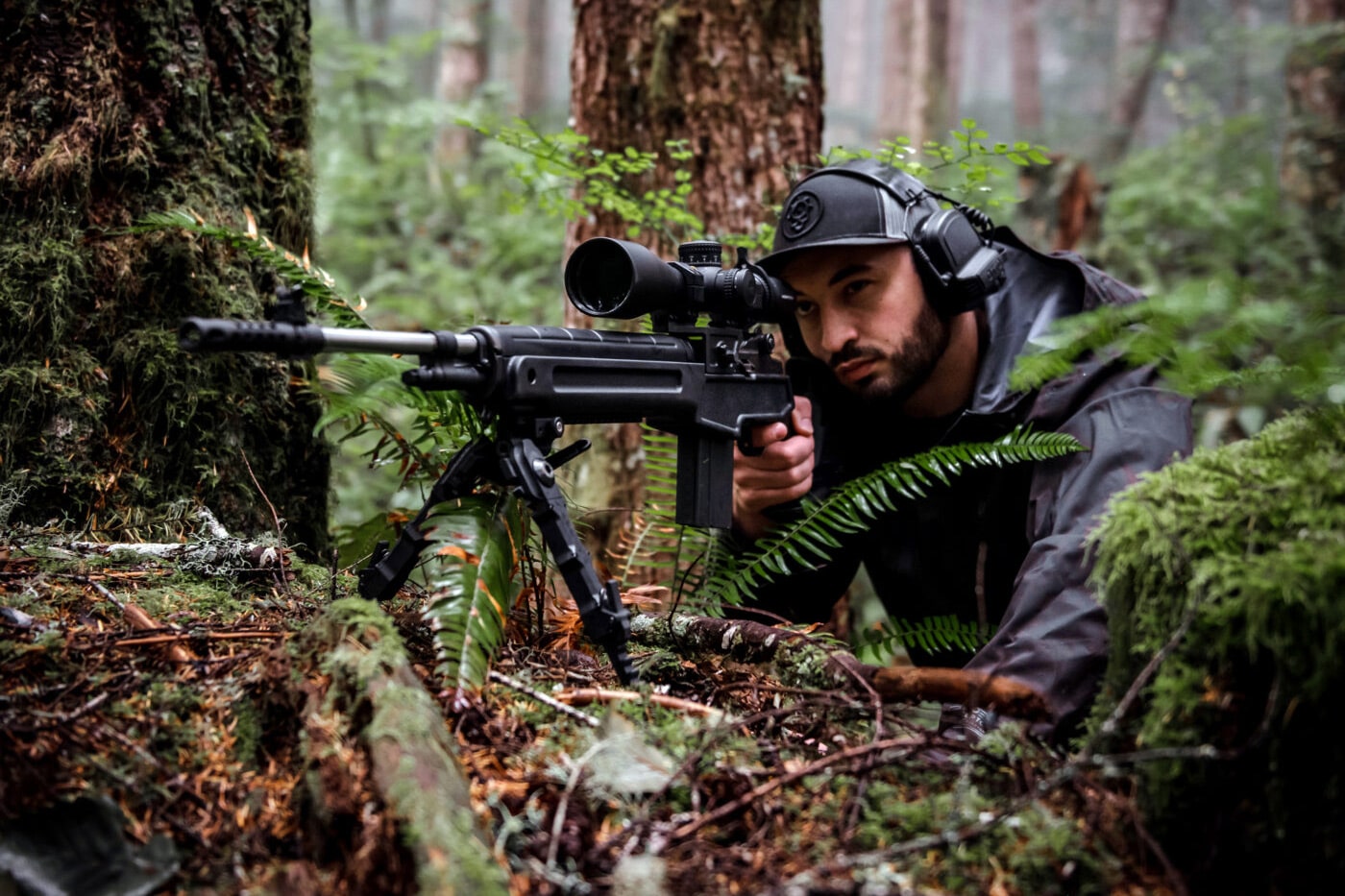 Precision shooter in woods with M1A Loaded with bipod attached