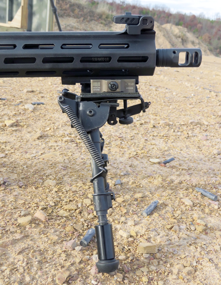 Adjustable legs on a bipod that is mounted to rifle
