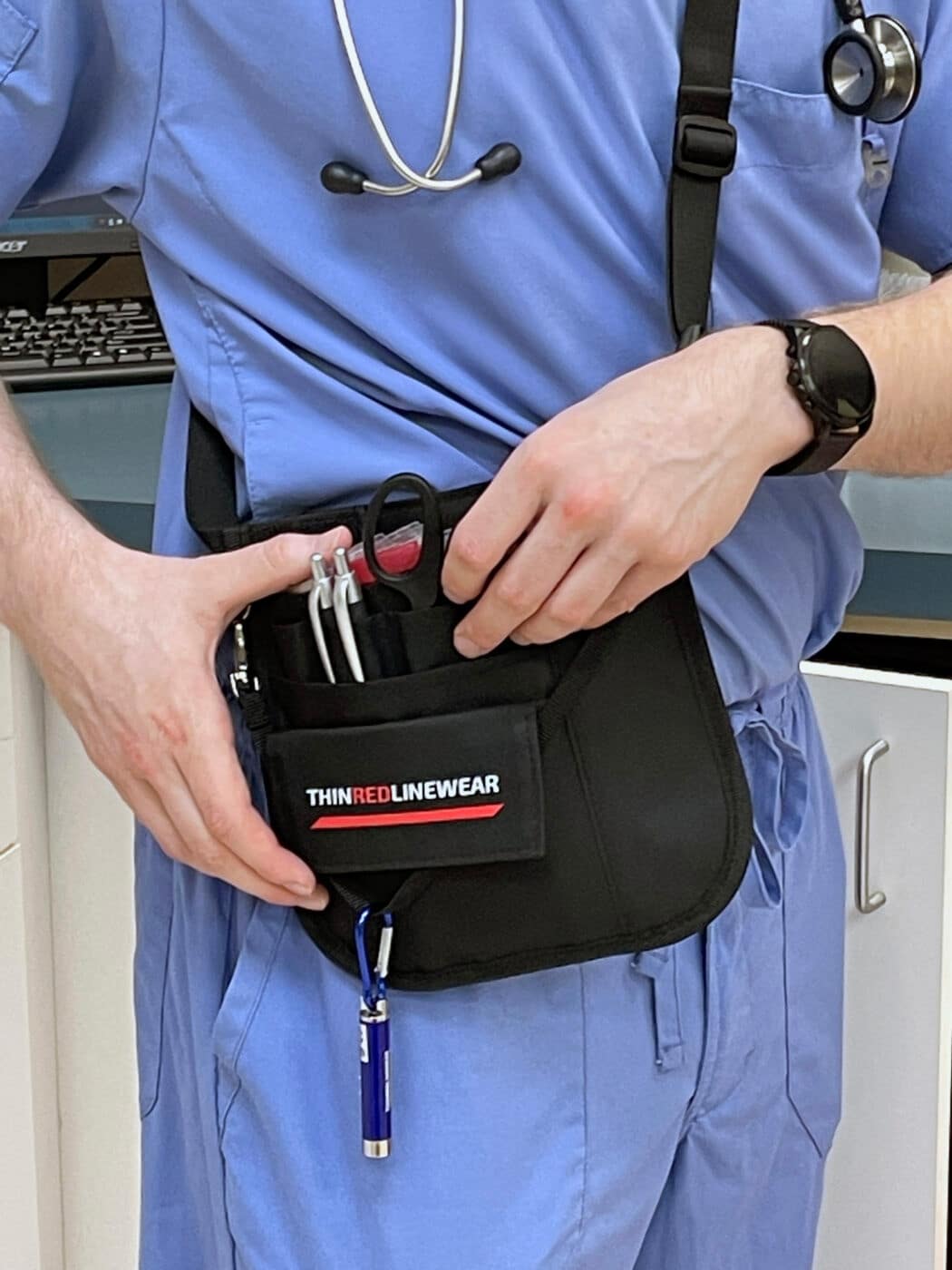 Thin Red Line Wear Go Bag being worn by medic personnel in scrubs