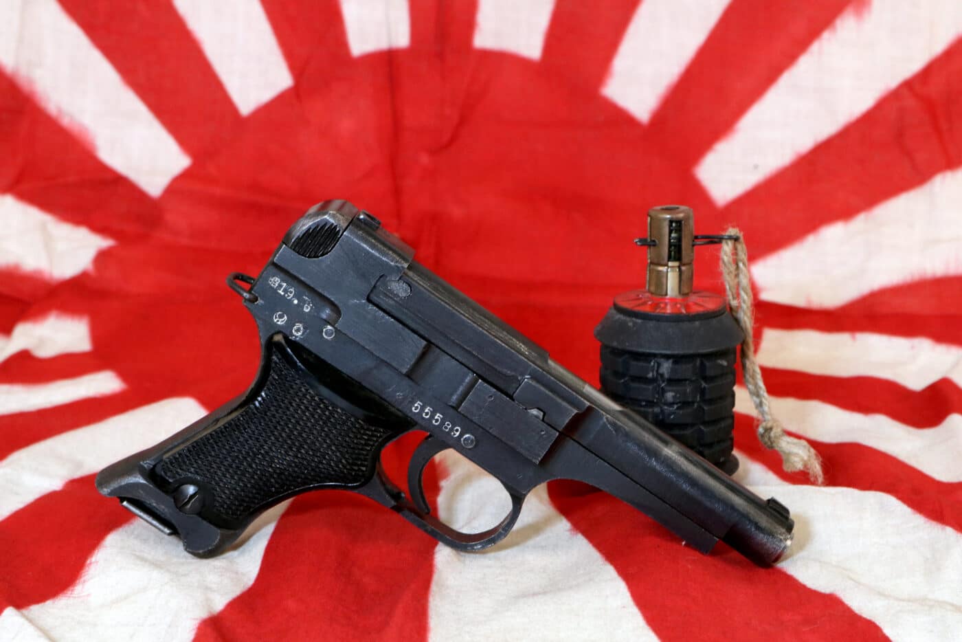Nambu Type 94 handgun with grenade