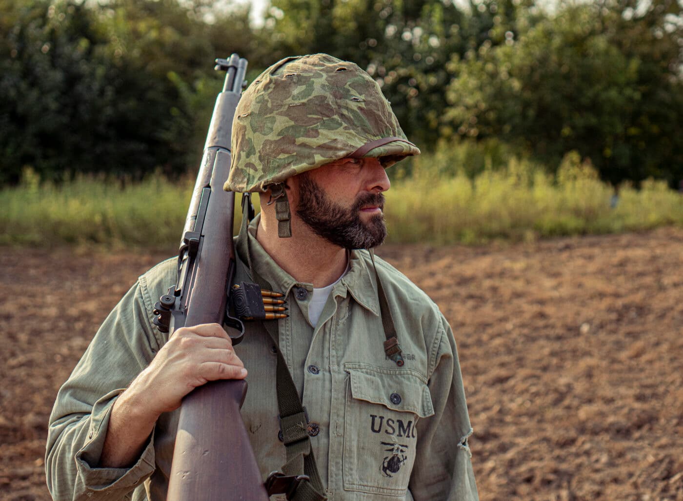 Close up of Marine carrying M1 Garand rifle