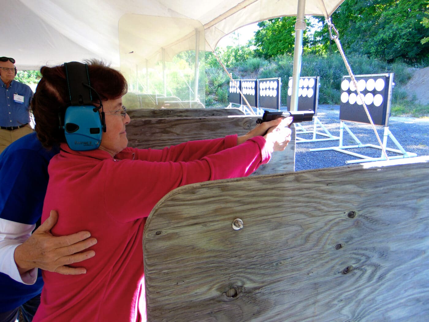 woman training with Springfield SA-35 pistol at Couples for Liberty seminar