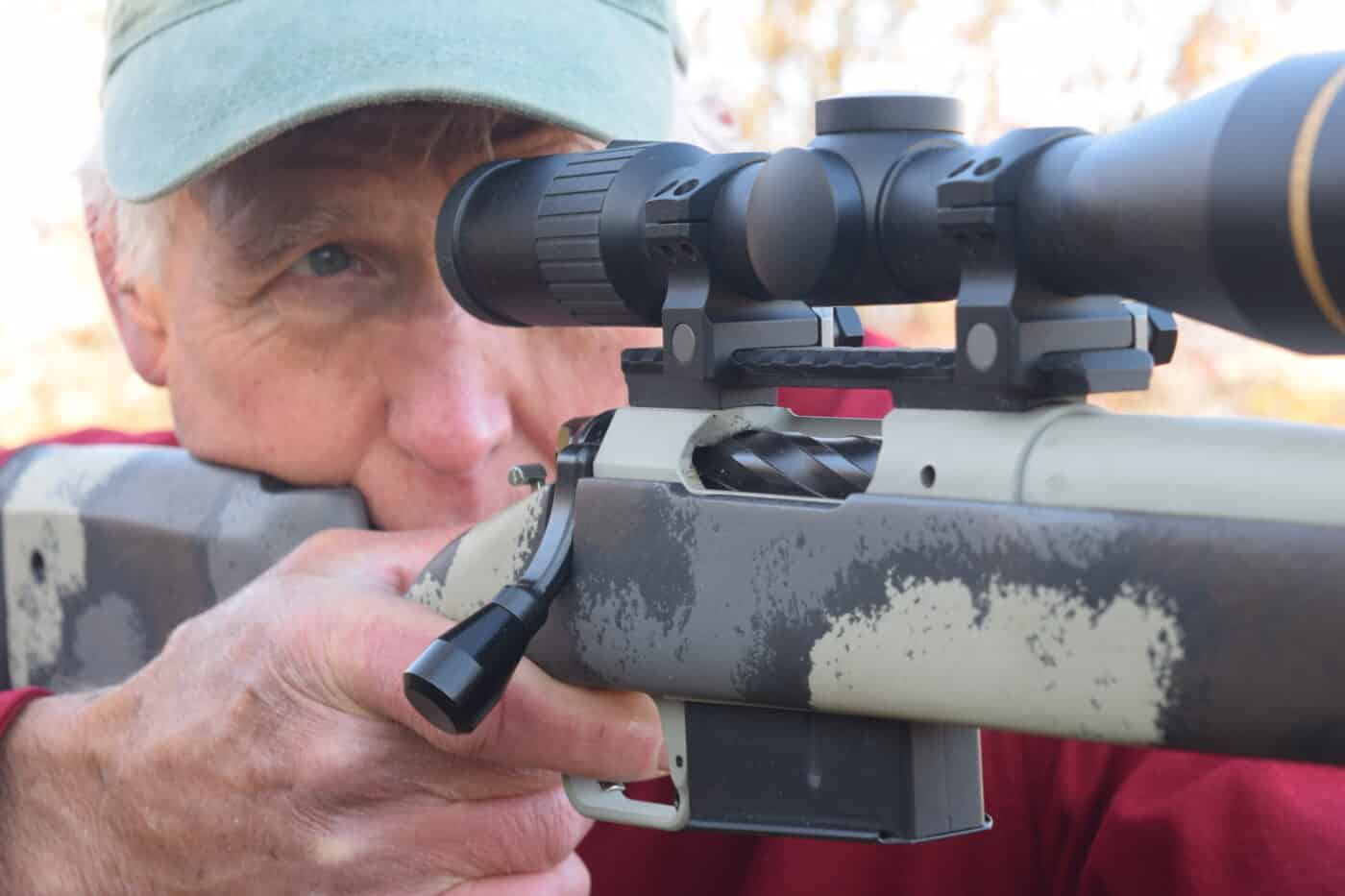 author firing a bolt action hunting rifle