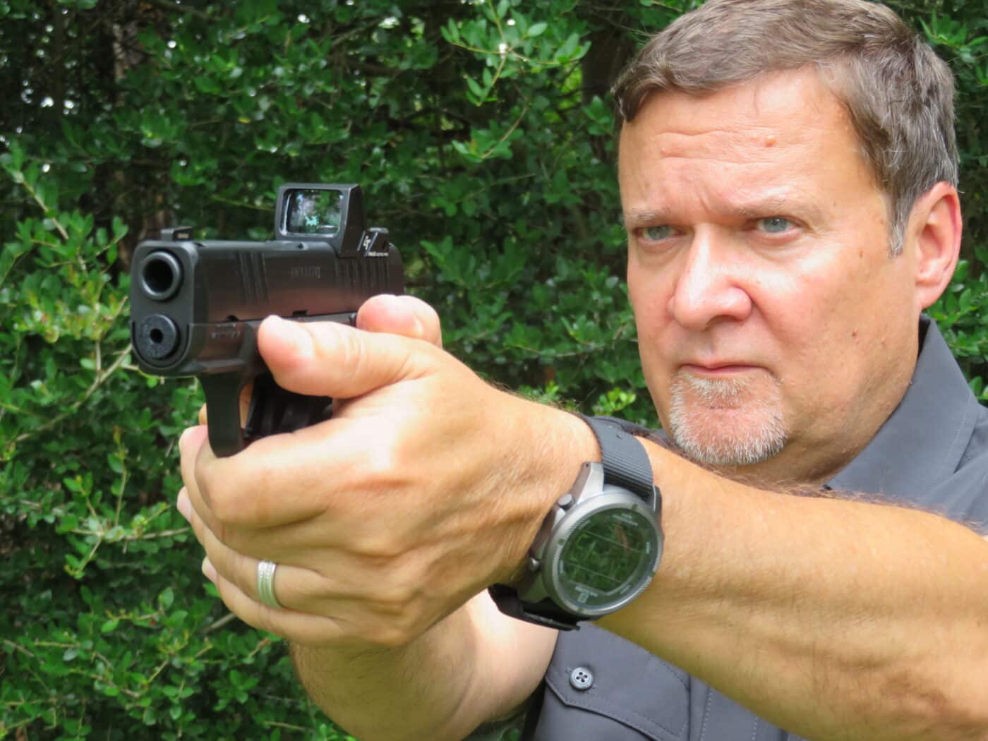 author testing the green dot sight on the range