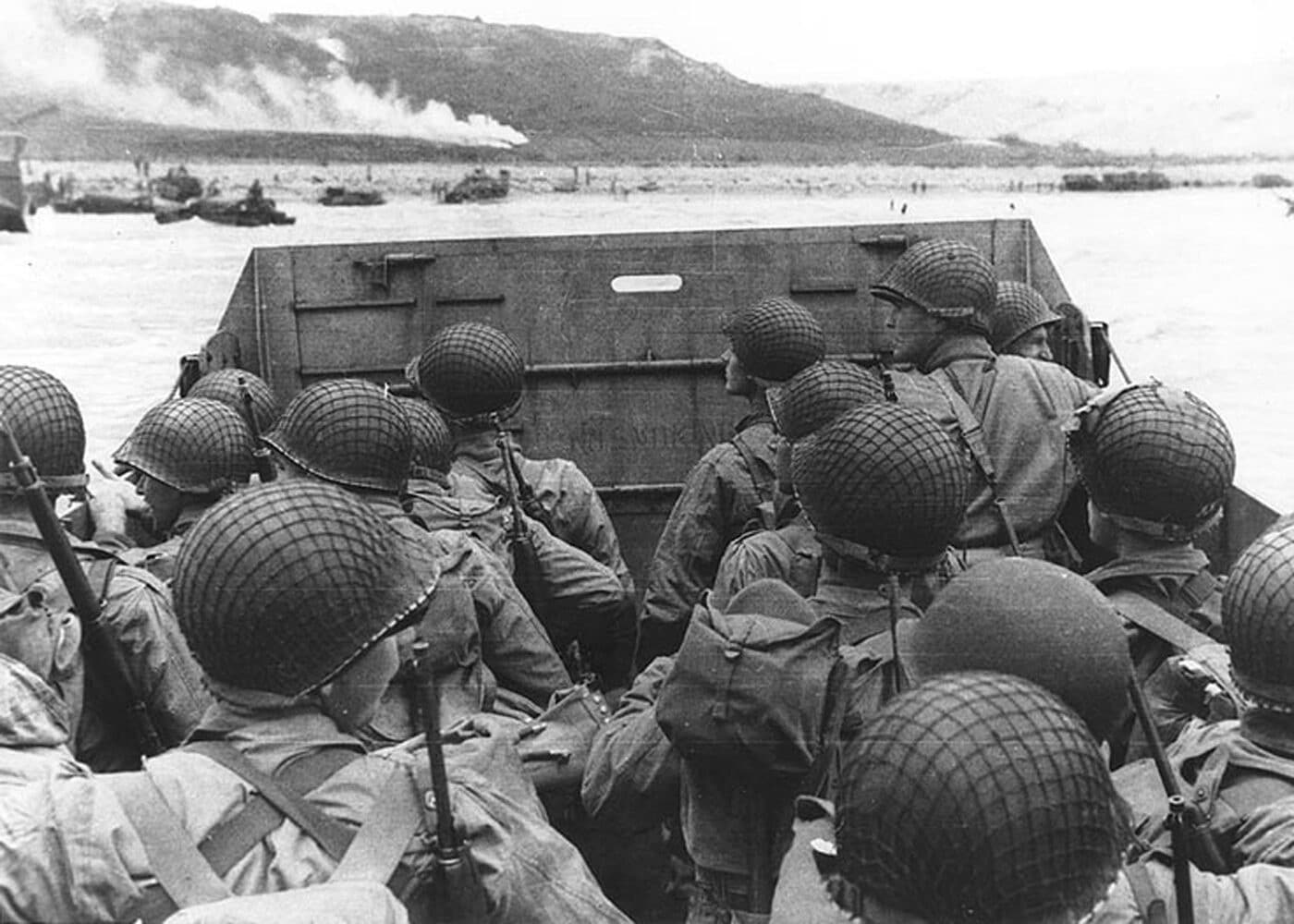 american troops landing at normandy wearing m1 helmets