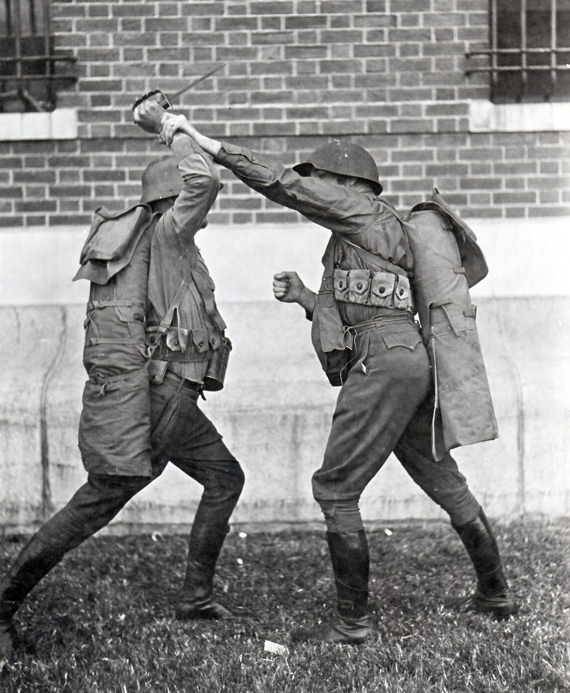 mike gibbons training with soldier in world war i wearing an experimental helmet