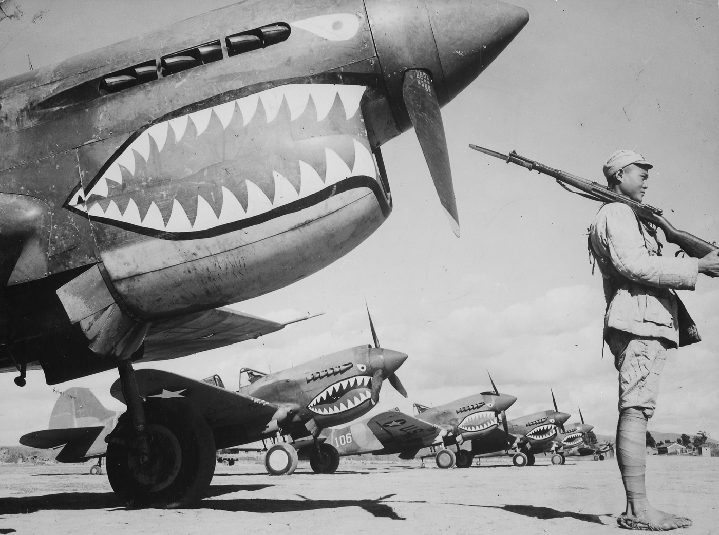 chinese soldier guards a p-40 flying tiger
