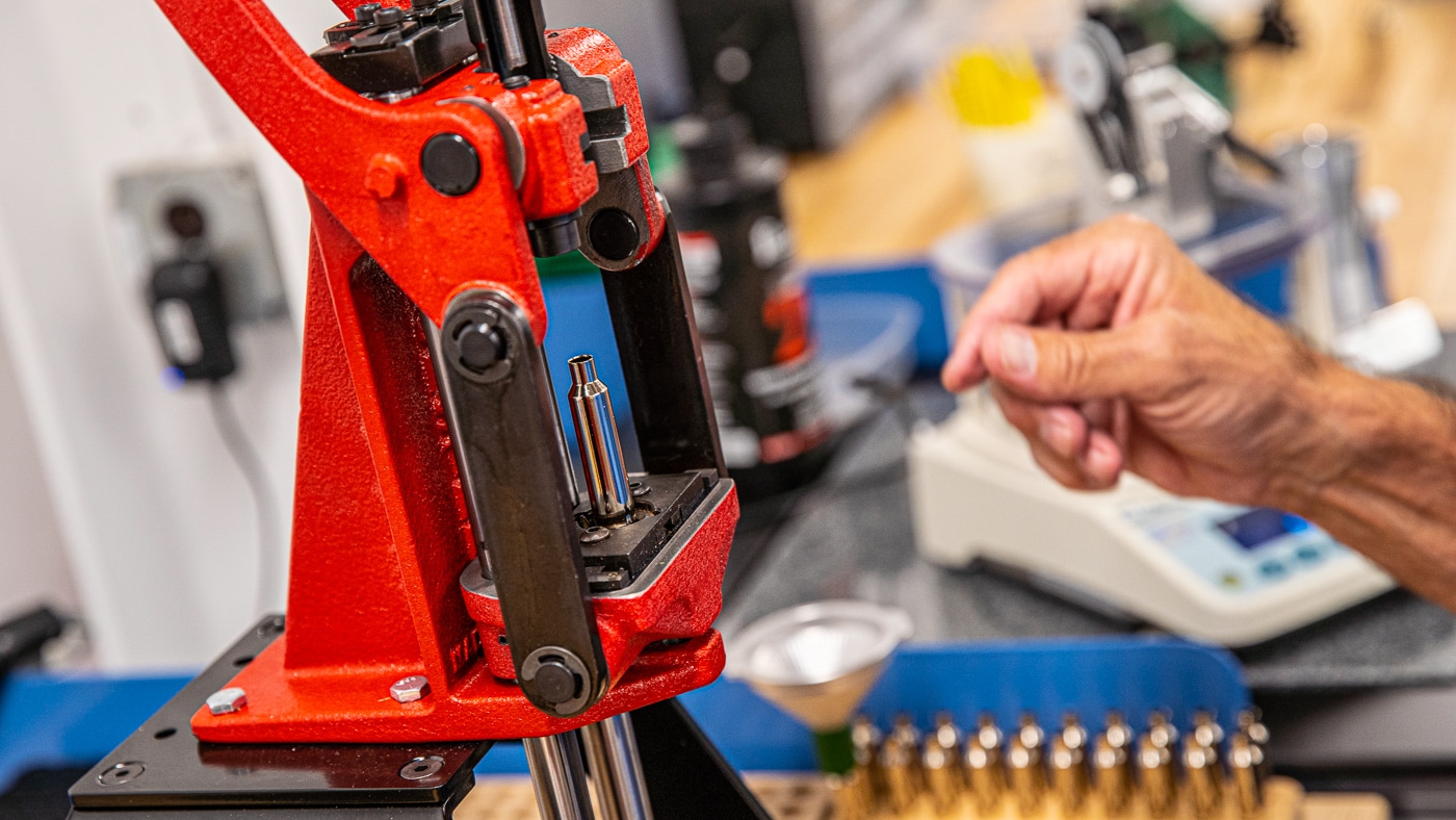 loading ammunition cartridges by hand in the custom shop