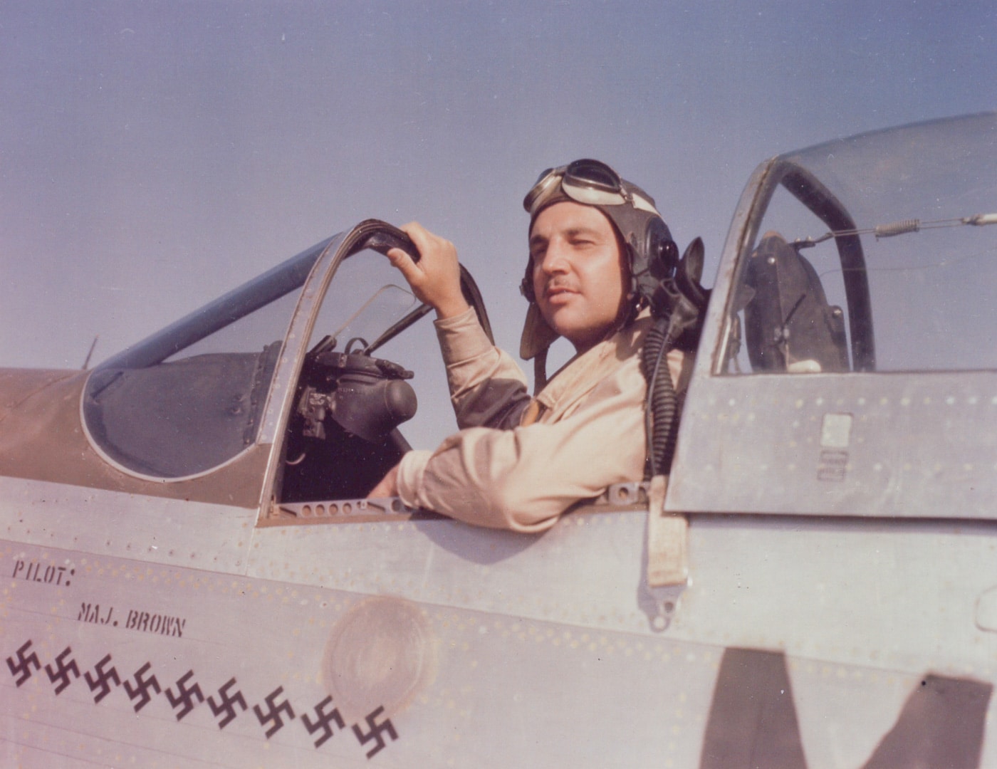 major sam brown in cockpit of p-51