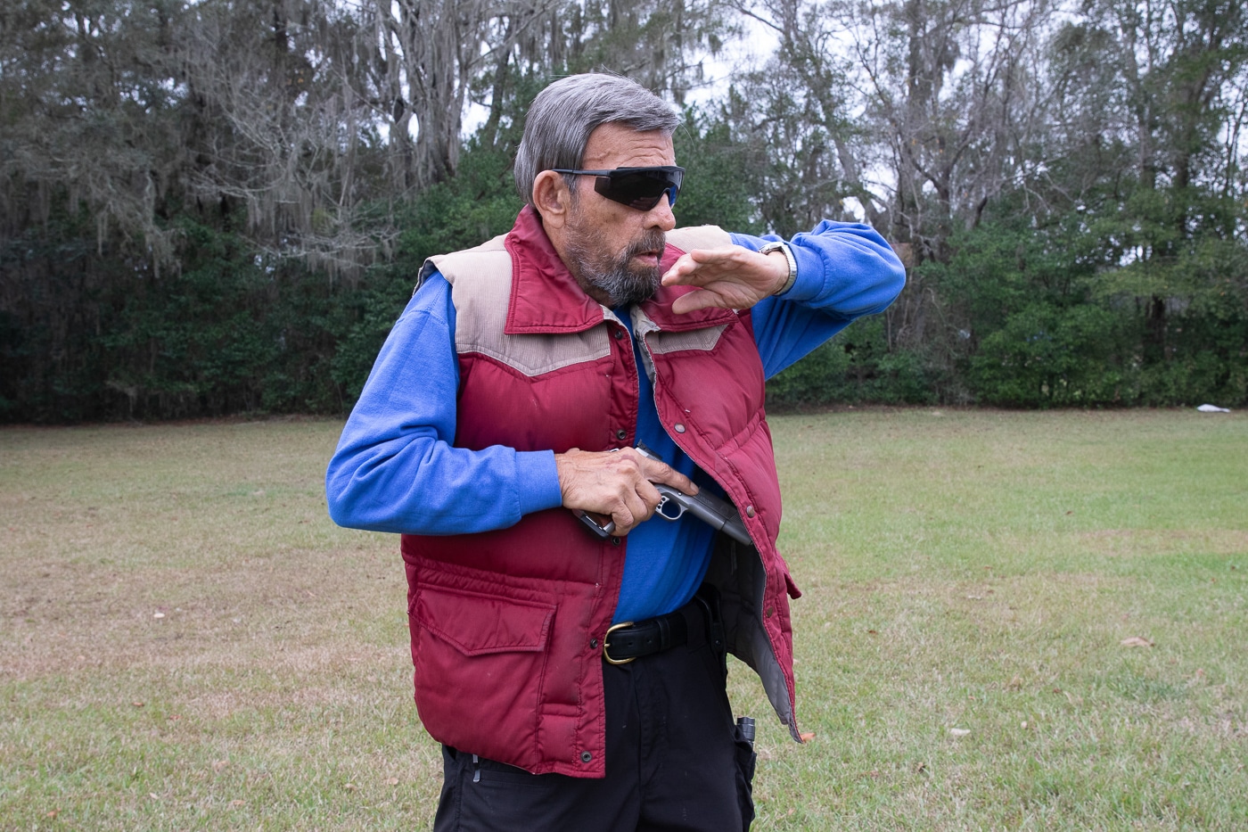 pulling gun out of a cross draw holster