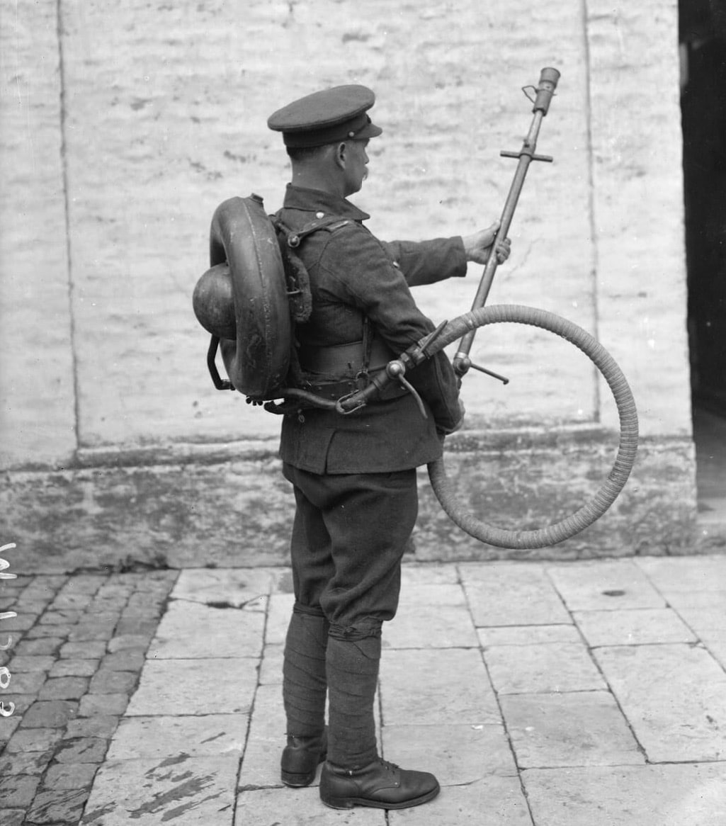british soldier demonstrates a wex flamethrower