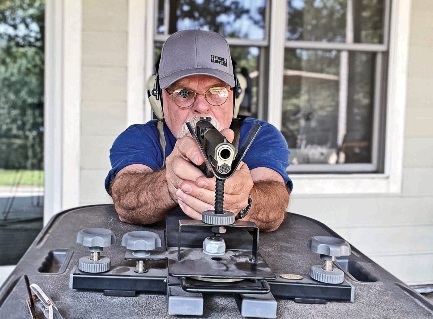 iron sights at 100 yards with a mil-spec 1911