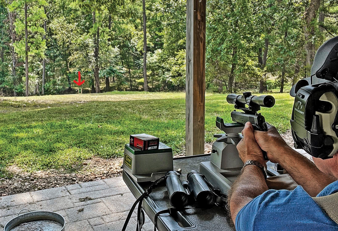 scoped mil-spec 1911 being shot