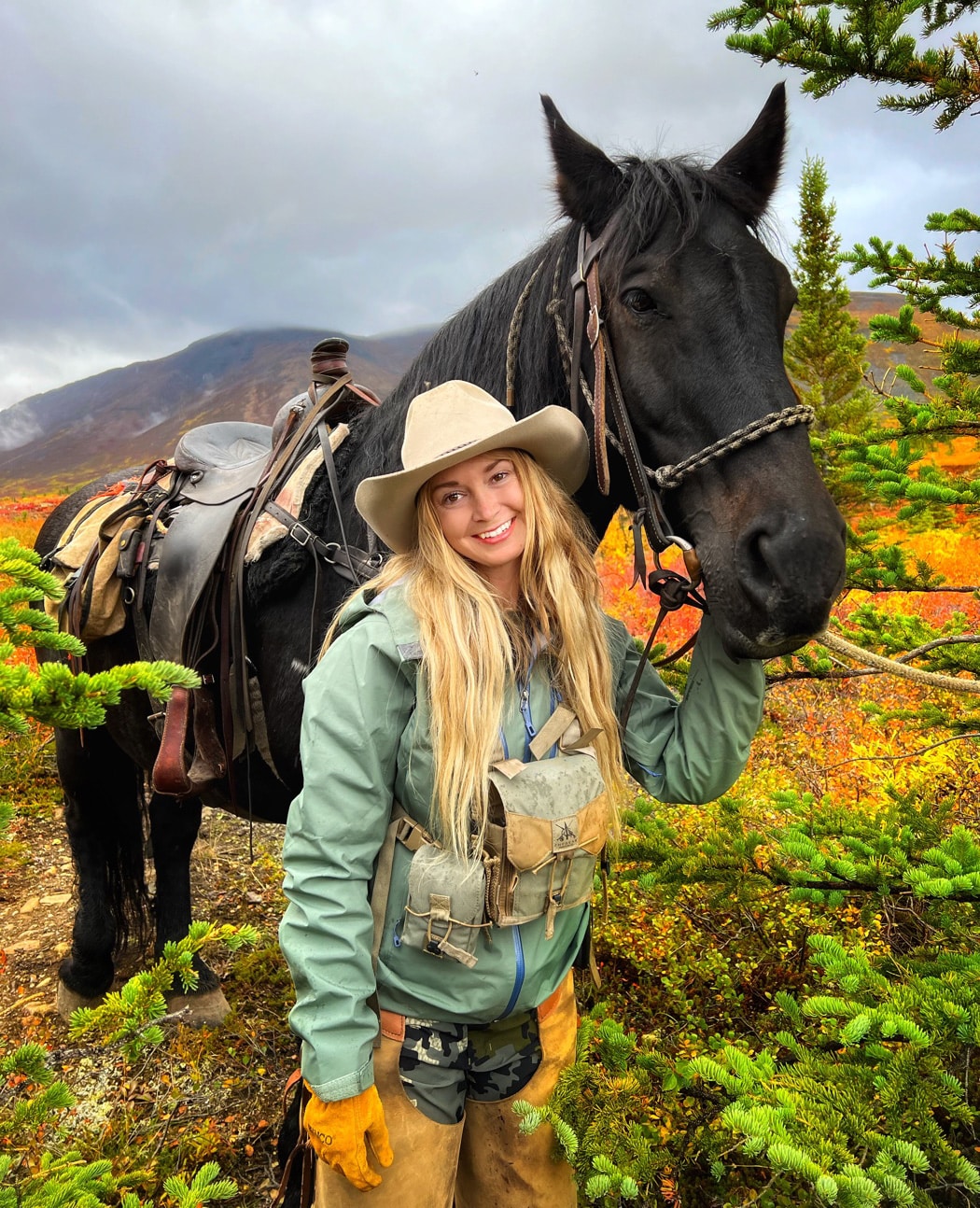 author with horse during alaskan moose hunt