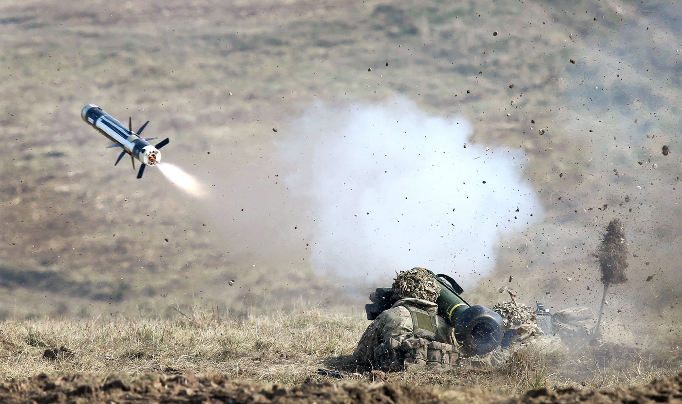 british soldiers firing a javelin at missile in training