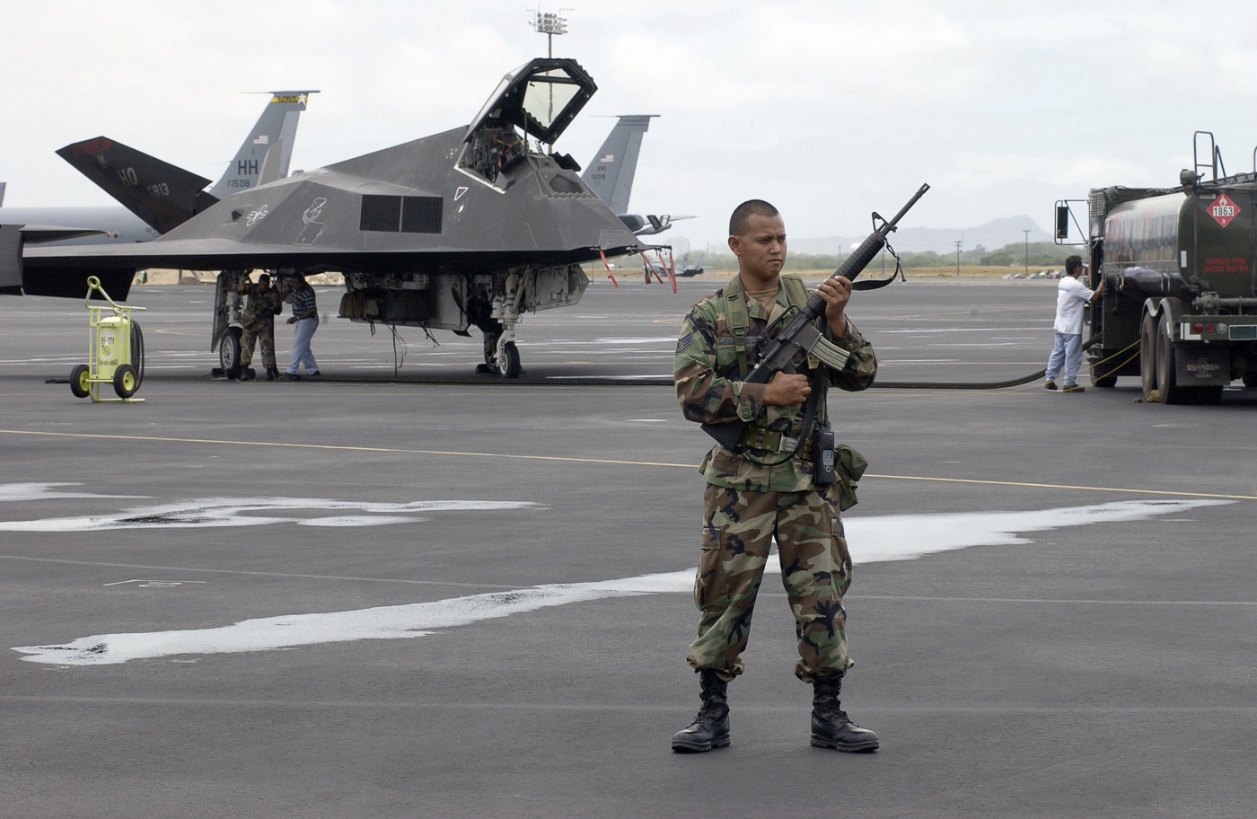 f-117 on runway guarded by usaf security team