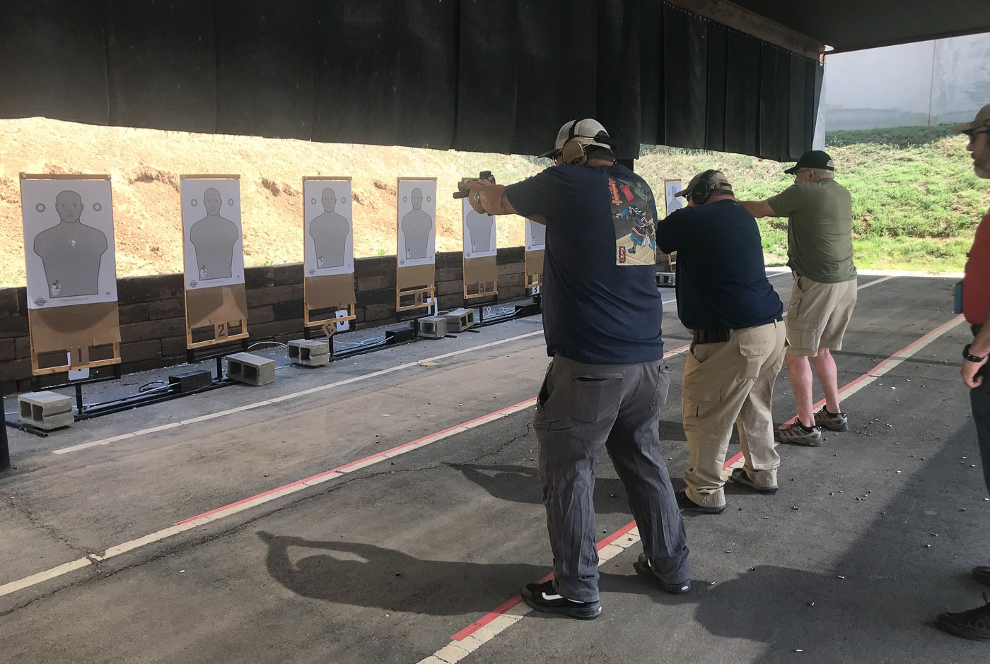 shooters training with red dot sights