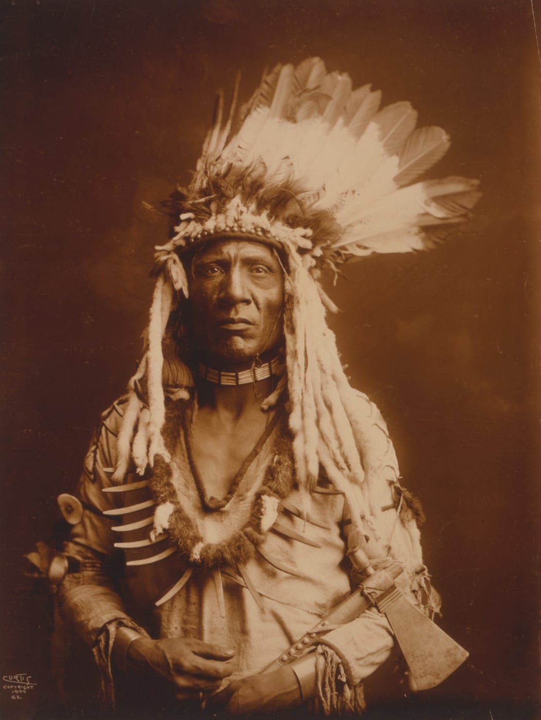 weasel tail portrait holding a tomahawk