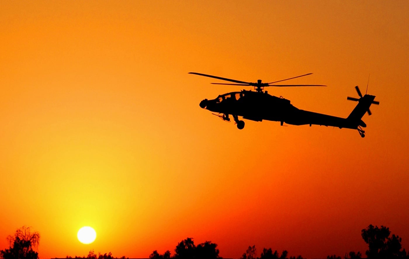 ah-64 lands at sunset in iraq