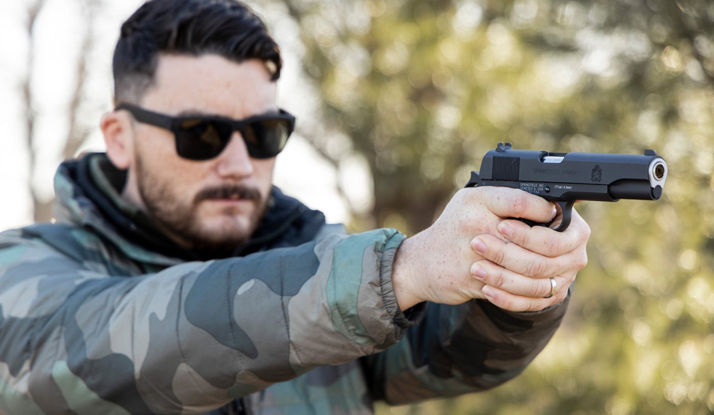 shooting the 1911 mil-spec 1911 air pistol on the range at targets