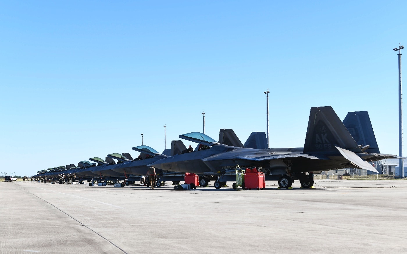 f-22 raptors lined up on the roadway