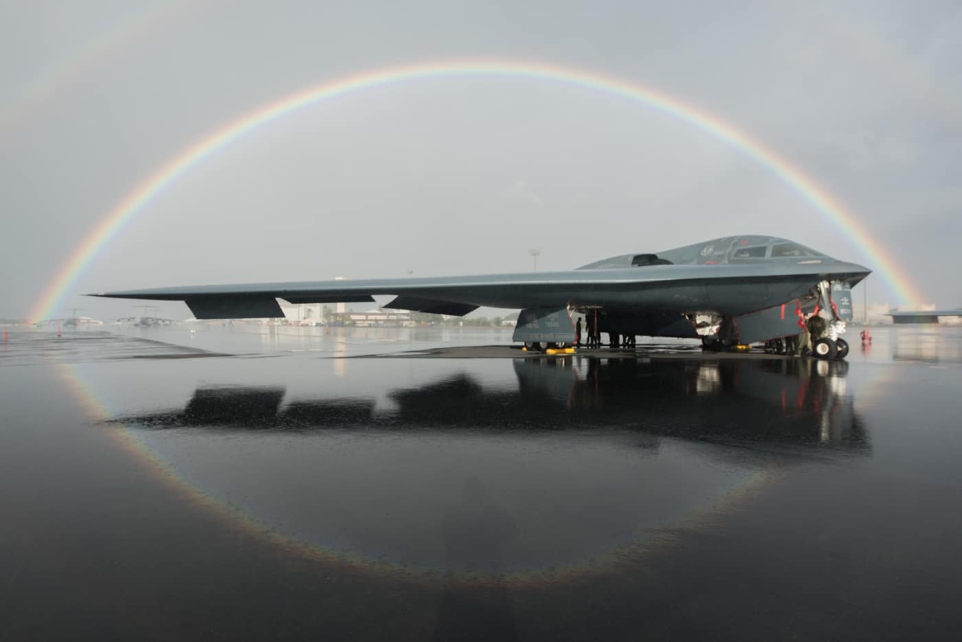 b-2 on runway with rainbow