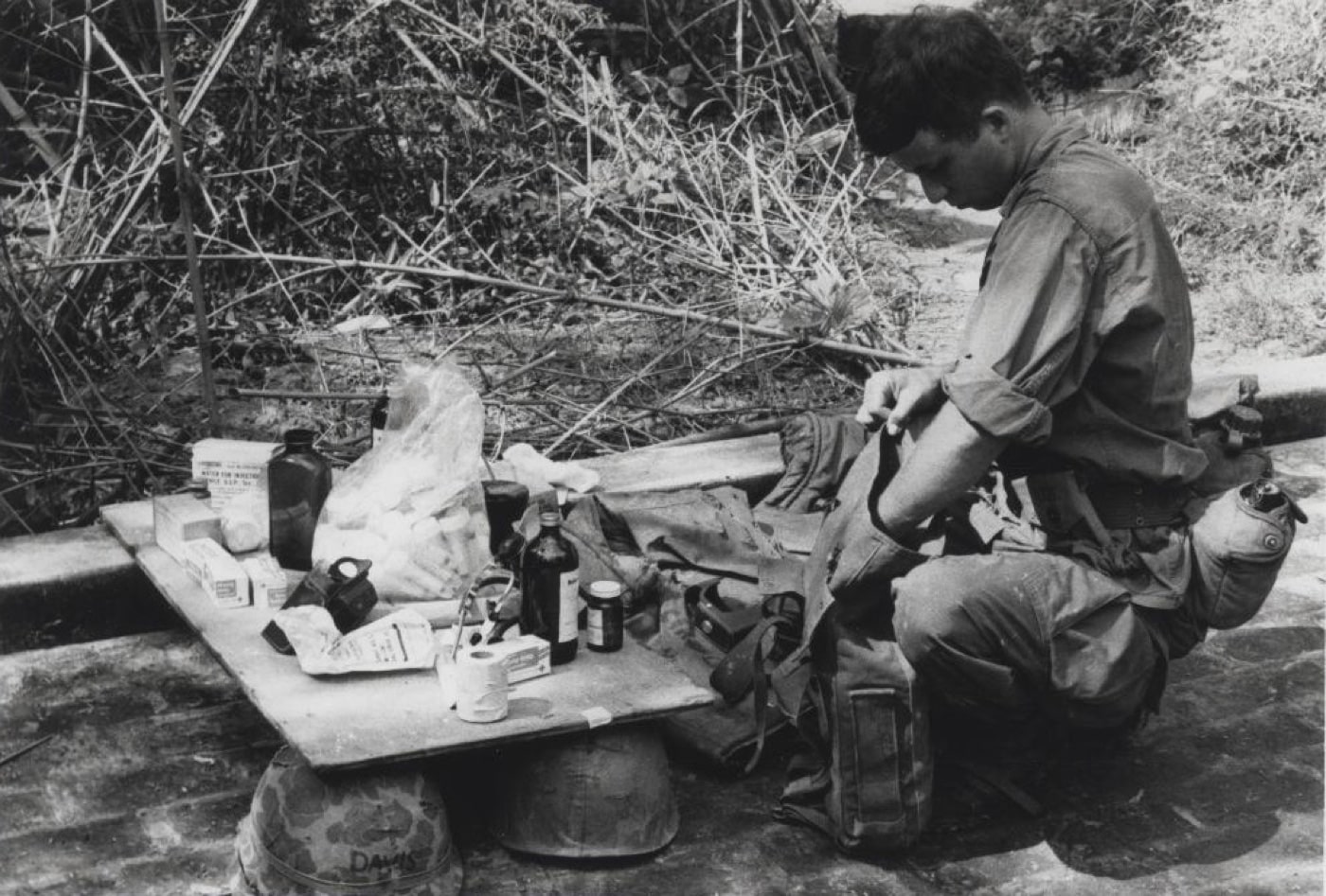 navy corpsman prepares to treat vietnam villagers