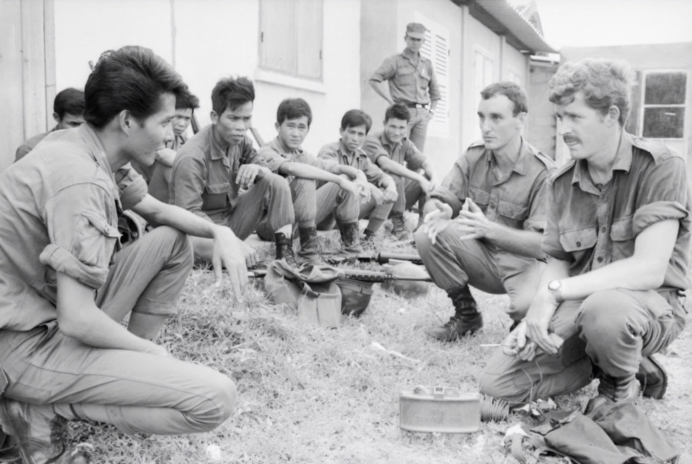 australian soldiers teach south vietnamese popular force members how to use a claymore