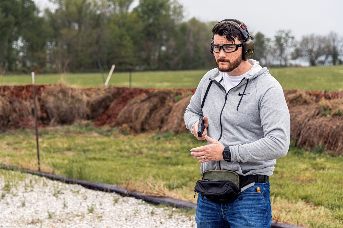 drawing a gun from a fanny pack