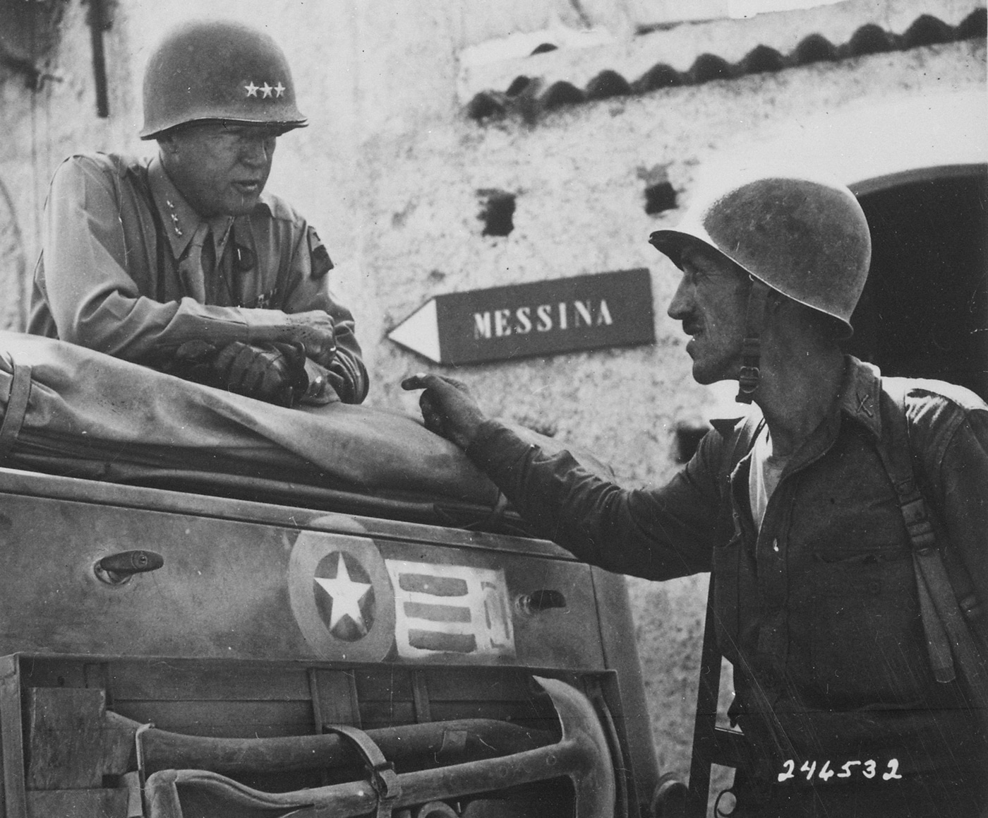 george patton in an armored vehicle near messina sicily