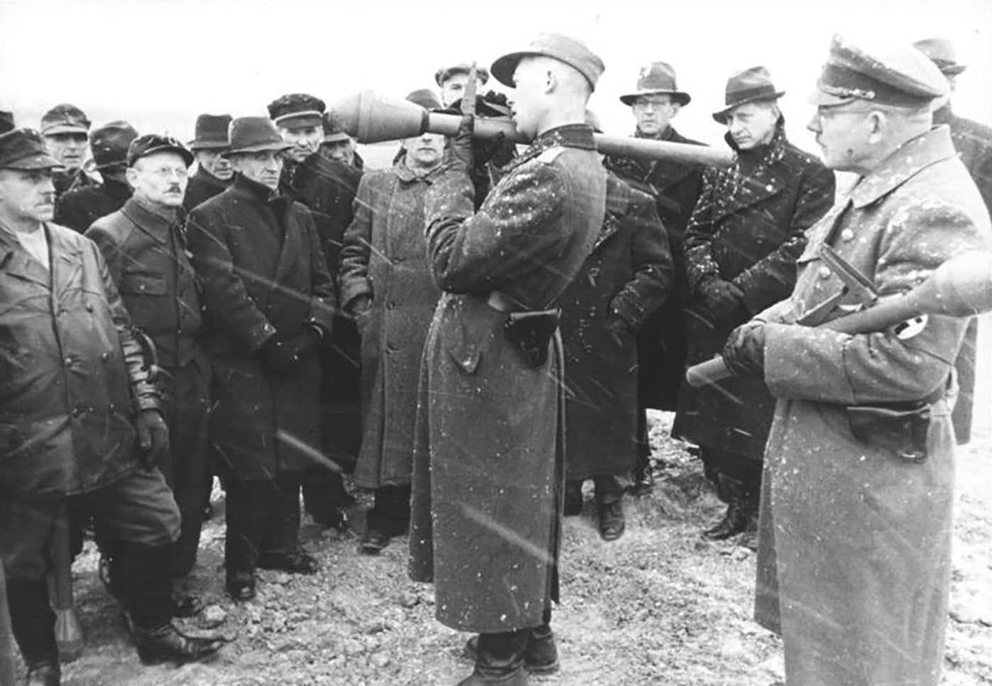 german soldier teaches vokssturm volunteers how to fire the panzerfaust