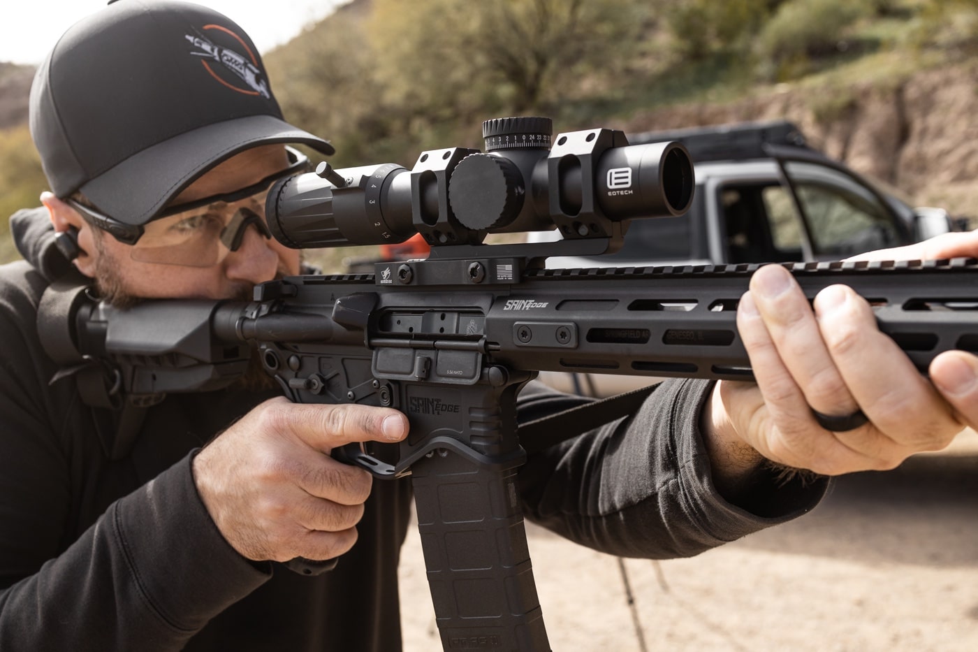 author testing the eotech scope on a saint ar-15 rifle