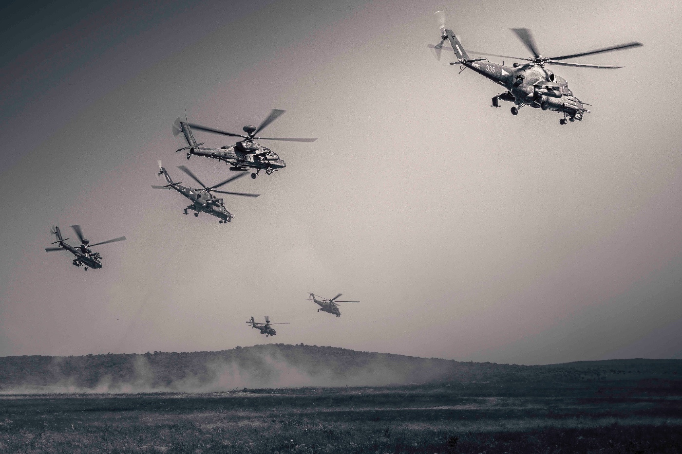 mi-24 hind and ah-64 apache helicopters in flight