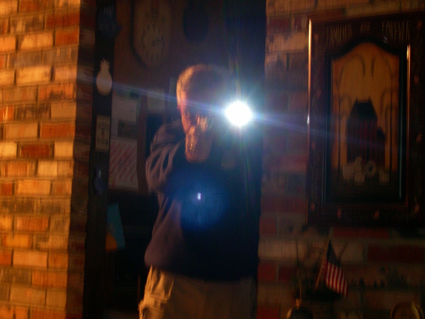 author demonstrating how to use a flashlight
