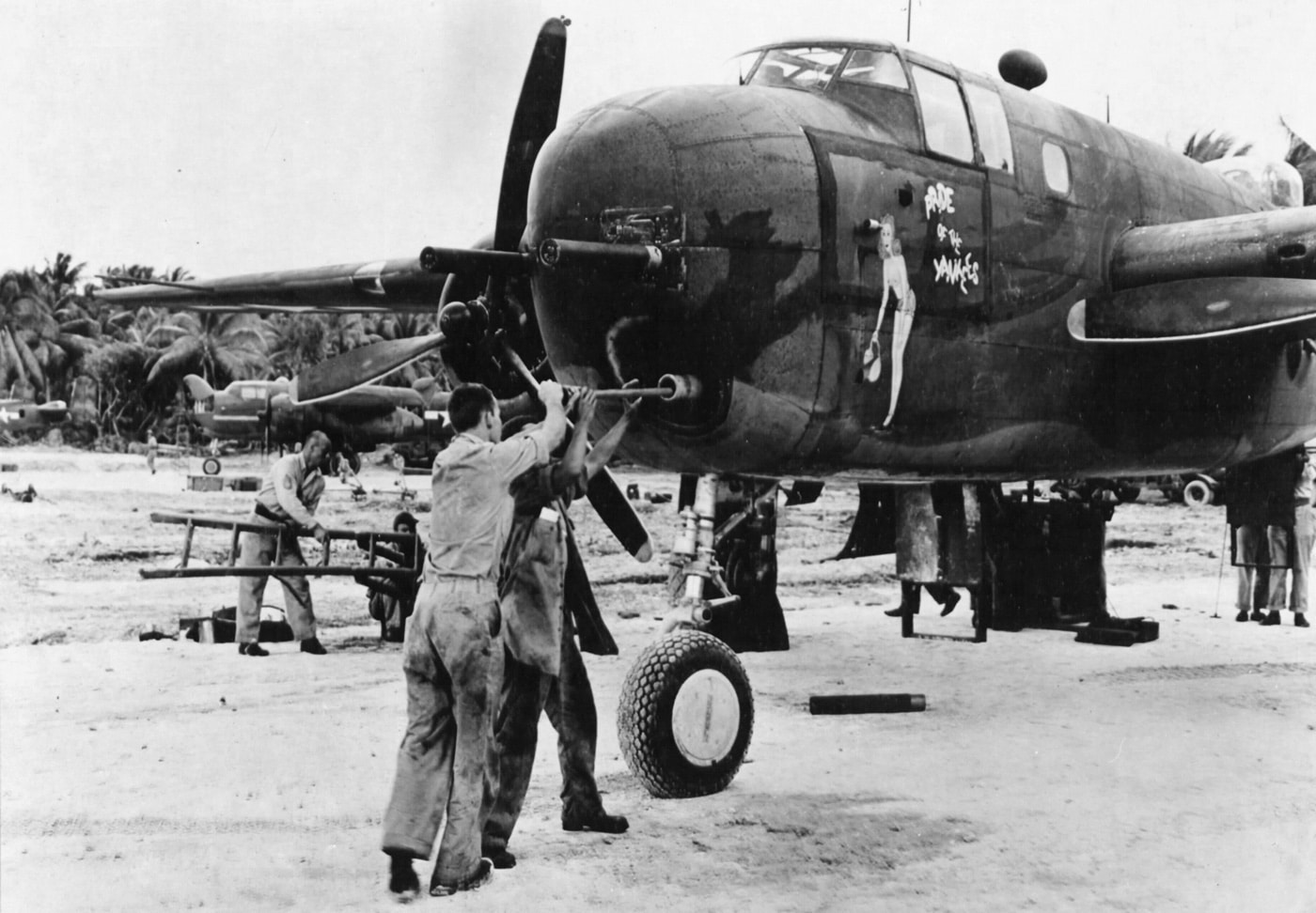 crew cleaning 75mm cannon on b-25