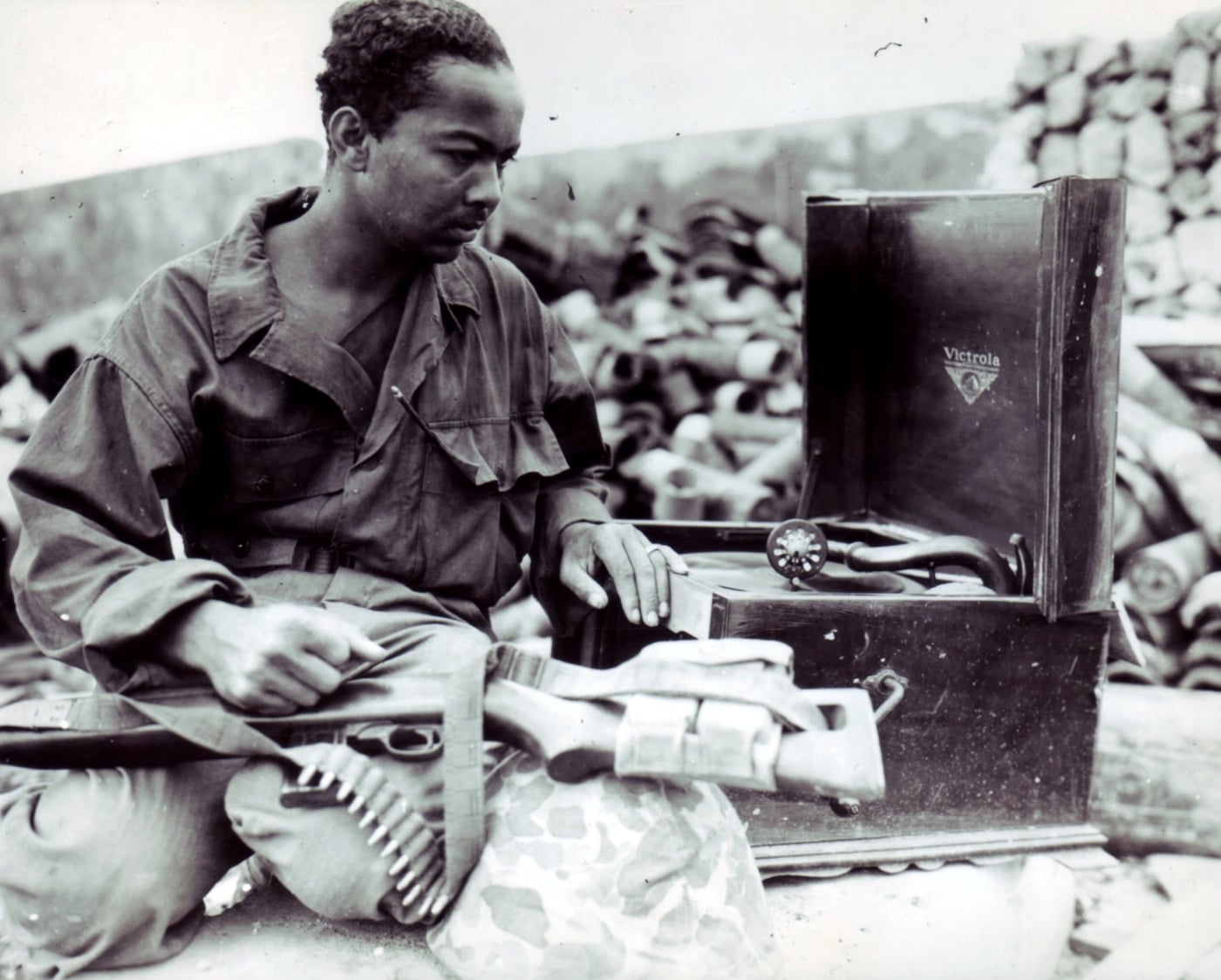 us marine with m1 carbine and victrola record player on okinawa