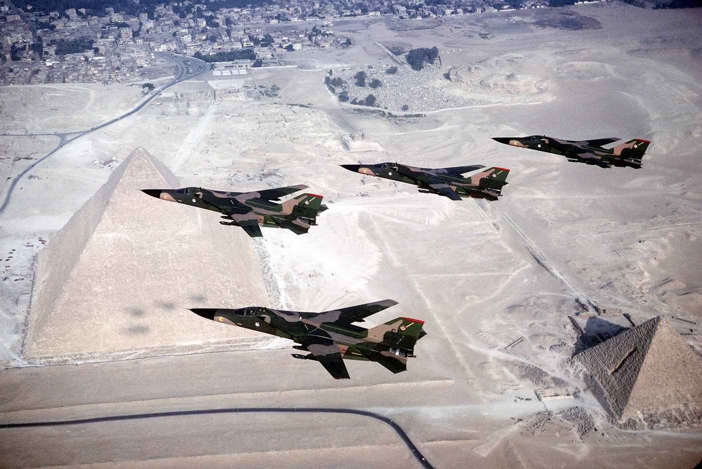 four f-111 fighter bombers in formation