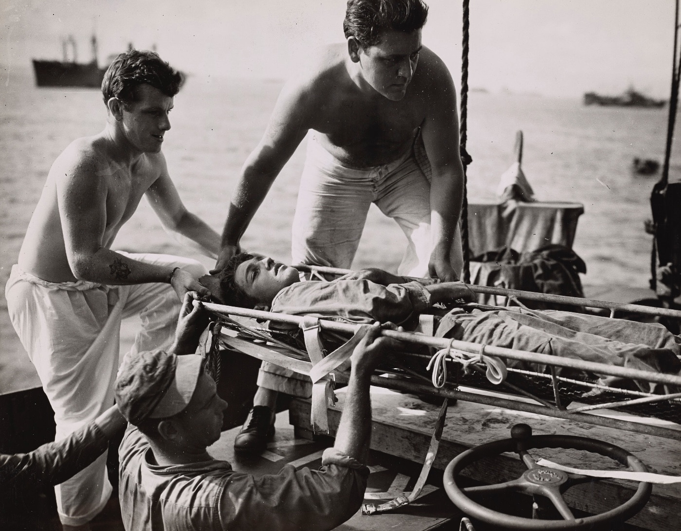 wounded marine is transported from peleliu to a hospital ship