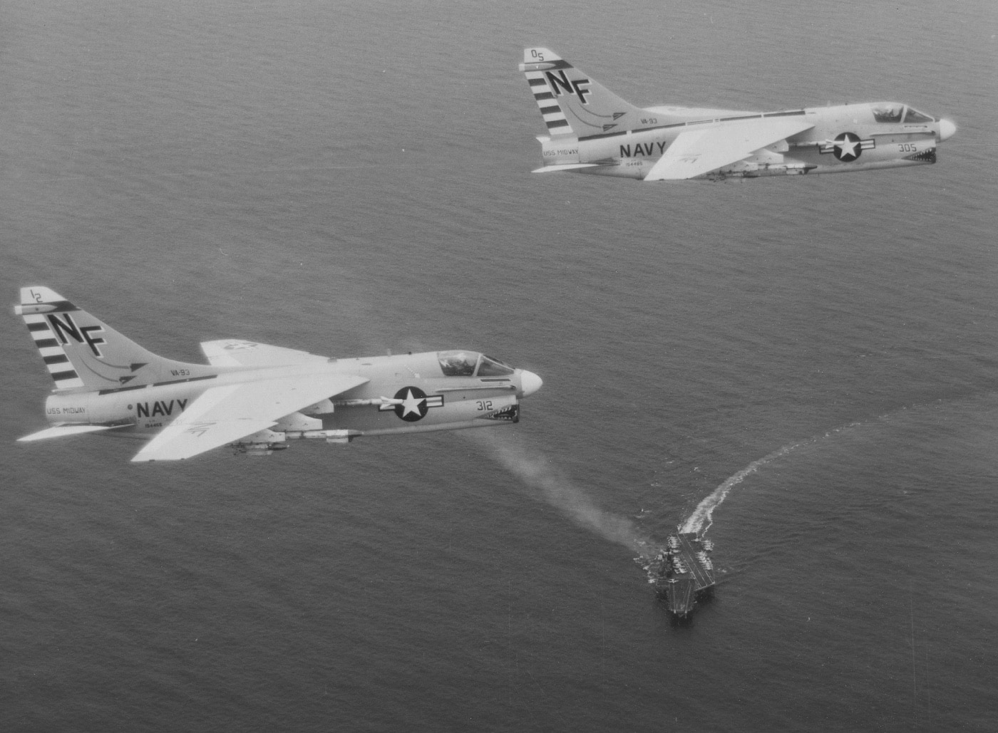 a-7 corsair ii flying in formation over uss midway